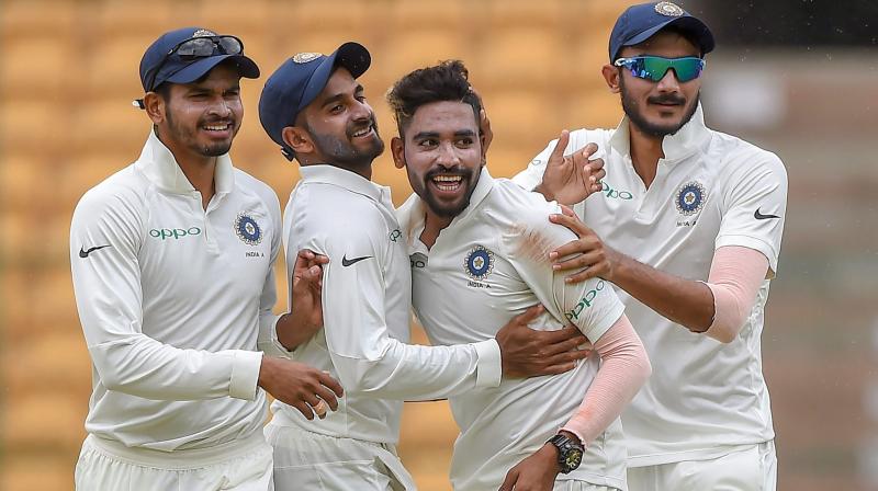 The trio of Siraj (10/128), Gurbani (4/92) and Navdeep Saini (3/71) took 17 out of the 20 wickets on a flat Chinnaswamy track. (Photo: PTI) The trio of Siraj (10/128), Gurbani (4/92) and Navdeep Saini (3/71) took 17 out of the 20 wickets on a flat Chinnaswamy track. (Photo: PTI)