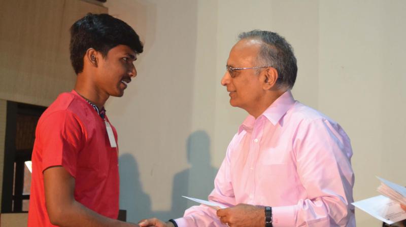 FFE founder Prabhu Goel awarding a scholarship cheque to an FFE scholar FFE founder Prabhu Goel awarding a scholarship cheque to an FFE scholar
