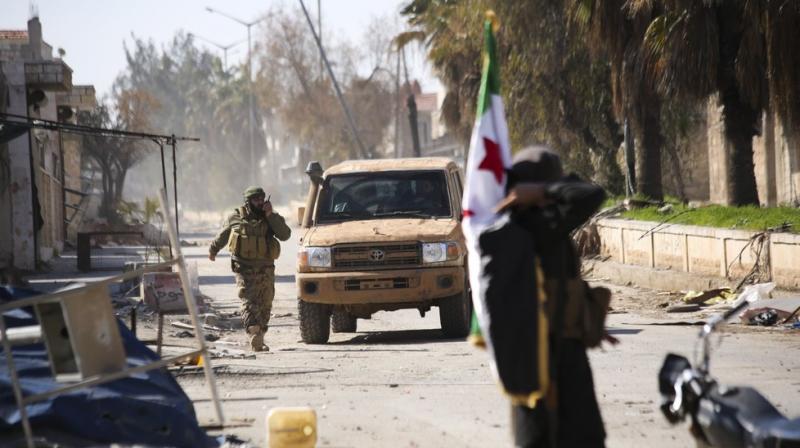 urkish backed Syrian rebels enter the own of Saraqeb, in Idlib province, Syria on Thursday. AP Photo