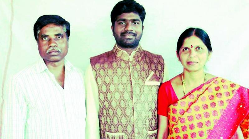 File photo of Poosa Sai Krishna with his father Yellaiah and mother Shailaja. File photo of Poosa Sai Krishna with his father Yellaiah and mother Shailaja.