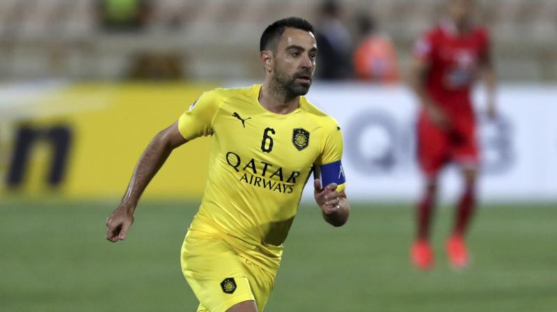 Barcelona legend Xavi Hernandez confirmed he had a conversation with Barcelona officials but remains committed to Qatai club Al-Sadd for now. (AP)