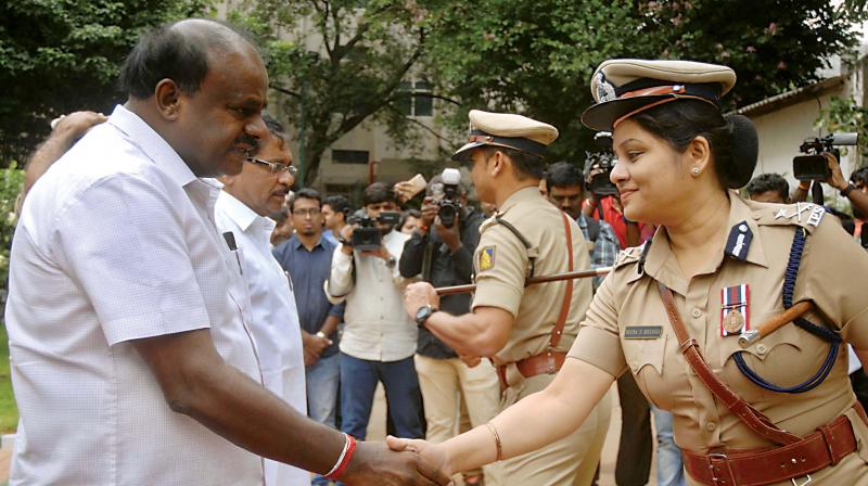 Senior Police officers welcome Chief Minister H.D. Kumaraswamy at DG and IGP’s Office in Bengaluru on Friday (Image: DC) Senior Police officers welcome Chief Minister H.D. Kumaraswamy at DG and IGP’s Office in Bengaluru on Friday (Image: DC)