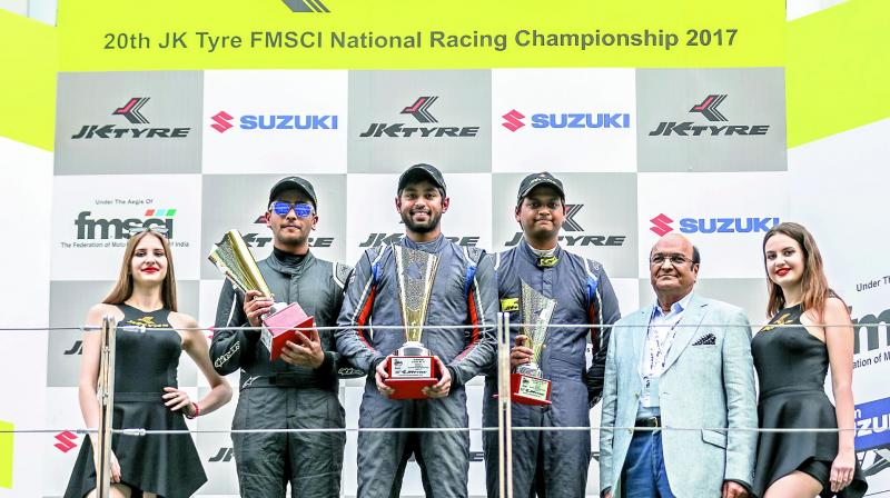 Nayan Chatterjee (from left), Anindith Reddy of Hyderabad and Vishnu Prasad pose with the trophies secured at the 20th JK Tyre FMSCI National Championship at the BIC. Nayan Chatterjee (from left), Anindith Reddy of Hyderabad and Vishnu Prasad pose with the trophies secured at the 20th JK Tyre FMSCI National Championship at the BIC.