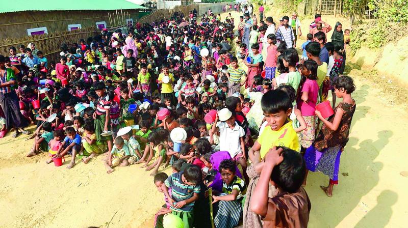 Rohingya refugee children wait for food at a food distribution center in Thankhali refugee camp in the Bangladeshi district of Ukhia on Thursday. (Photo: AFP) Rohingya refugee children wait for food at a food distribution center in Thankhali refugee camp in the Bangladeshi district of Ukhia on Thursday. (Photo: AFP)
