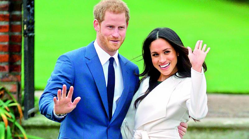Britain’s Prince Harry and his fiancée Meghan Markle at the Sunken Garden. Britain’s Prince Harry and his fiancée Meghan Markle at the Sunken Garden.