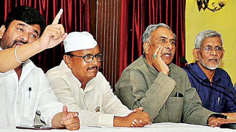 A file photo of Minister Vinay Kulkarni with Lingayat leaders B.R. Patil, Basavaraj Horatti and S.M. Jamdar A file photo of Minister Vinay Kulkarni with Lingayat leaders B.R. Patil, Basavaraj Horatti and S.M. Jamdar