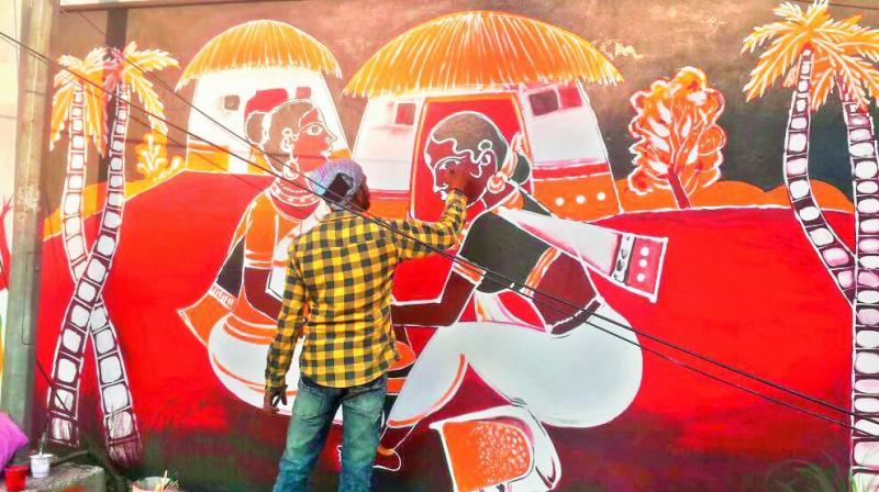 An artist works on a paiting on one of the landmark sites in the city on Saturday, that are being readied for the upcoming World Telugu Conference. An artist works on a paiting on one of the landmark sites in the city on Saturday, that are being readied for the upcoming World Telugu Conference.