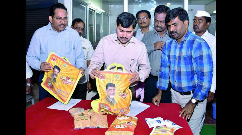East Godavari Joint Collector A. Mallikarjuna inspects packets that would be distributed as Chandranna Kanuka for Christmas at a programme in Kakinada on Friday. (Photo: DC) East Godavari Joint Collector A. Mallikarjuna inspects packets that would be distributed as Chandranna Kanuka for Christmas at a programme in Kakinada on Friday. (Photo: DC)