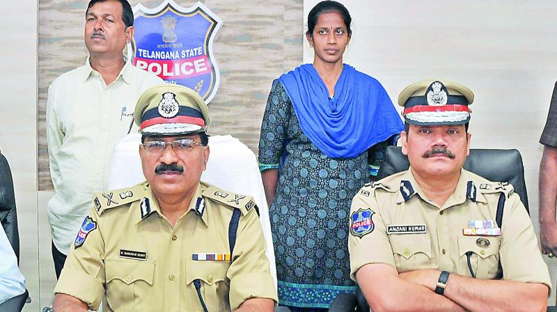 Mr M. Mahender Reddy, DGP, with Jilugu Narsimha Reddy alias Jampanna and his wife Anitha alias Rajitha after their surrendered at a press conference on Monday. (Photo: DC) Mr M. Mahender Reddy, DGP, with Jilugu Narsimha Reddy alias Jampanna and his wife Anitha alias Rajitha after their surrendered at a press conference on Monday. (Photo: DC)