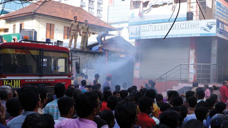 Fire and rescue force personnel douse the fire at Electronic street near Pallimukku in Kochi on Thursday. (Photo: DC) Fire and rescue force personnel douse the fire at Electronic street near Pallimukku in Kochi on Thursday. (Photo: DC)