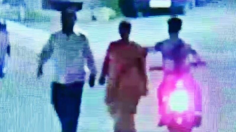 CCTV footage of the suspect robbing a woman of her gold chain at KPHB. CCTV footage of the suspect robbing a woman of her gold chain at KPHB.