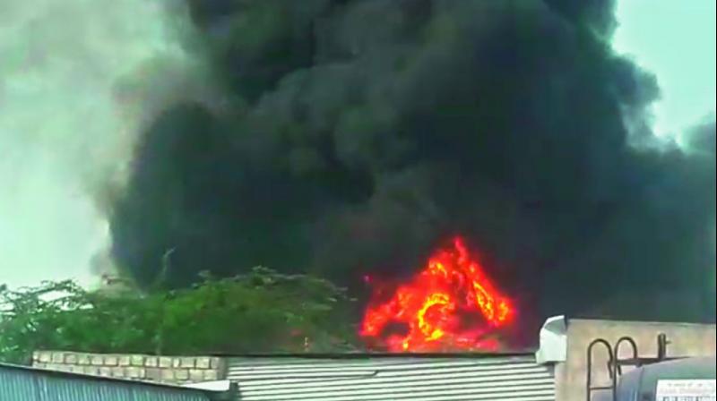 Smoke rises from the diesel tanker that caught fire at Chengicherla on Friday. Smoke rises from the diesel tanker that caught fire at Chengicherla on Friday.