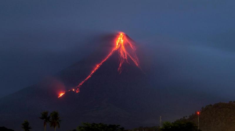 The eruptions have shrouded nearby villages in darkness and sent lava, rocks and debris cascading down Mayon's slopes toward the no-entry danger zone.(Photo: AP) The eruptions have shrouded nearby villages in darkness and sent lava, rocks and debris cascading down Mayon's slopes toward the no-entry danger zone.(Photo: AP)