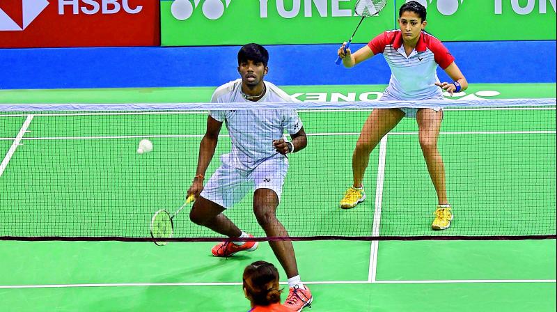 Indians Rankireddy Satwiksairaj and Ashwini Ponnappa in action during their mixed doubles second round match against Malaysia’s Tan Kian Meng and Lai Pei Jing at the India Open at Siri Fort Indoor Stadium in New Delhi on Thursday. Satwik-Ashwini won 21-16, 15-21, 23-21. (Photo:PTI) Indians Rankireddy Satwiksairaj and Ashwini Ponnappa in action during their mixed doubles second round match against Malaysia’s Tan Kian Meng and Lai Pei Jing at the India Open at Siri Fort Indoor Stadium in New Delhi on Thursday. Satwik-Ashwini won 21-16, 15-21, 23-21. (Photo:PTI)
