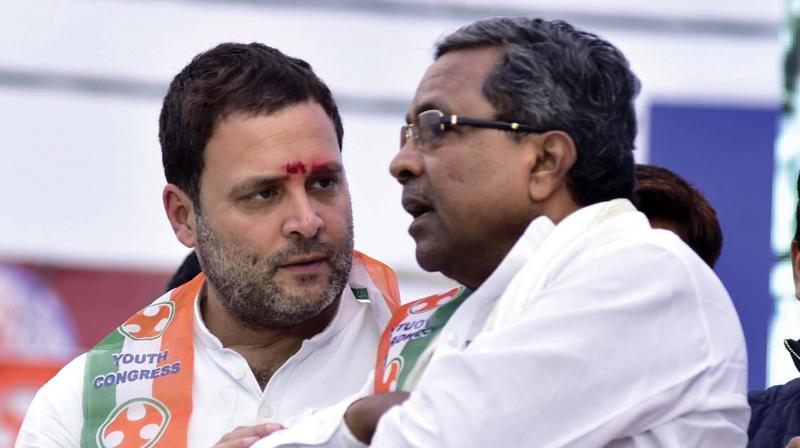 Congress President Rahul Gandhi in conversation with CM Siddaramaiah at Sindhanur in Raichur district on Sunday. (Photo:KPN) Congress President Rahul Gandhi in conversation with CM Siddaramaiah at Sindhanur in Raichur district on Sunday. (Photo:KPN)