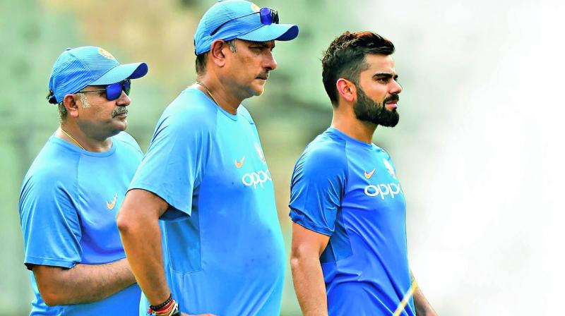 India captain Virat Kohli with coach Ravi Shastri and bowling coach Bharath Arun. (Photo:AFP) India captain Virat Kohli with coach Ravi Shastri and bowling coach Bharath Arun. (Photo:AFP)