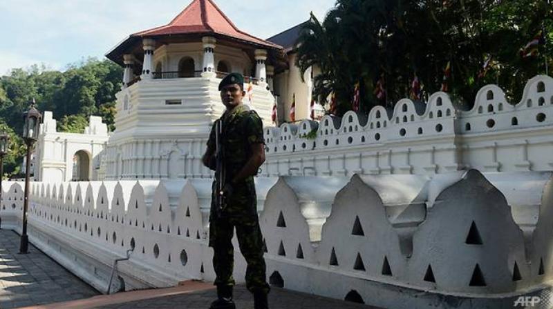 The government sent troops and elite police to Kandy after a mob set fire to a Muslim-owned shop, imposing a curfew there on Monday to prevent clashes between majority Sinhalese Buddhists and minority Muslims. (Photo: AFP) The government sent troops and elite police to Kandy after a mob set fire to a Muslim-owned shop, imposing a curfew there on Monday to prevent clashes between majority Sinhalese Buddhists and minority Muslims. (Photo: AFP)