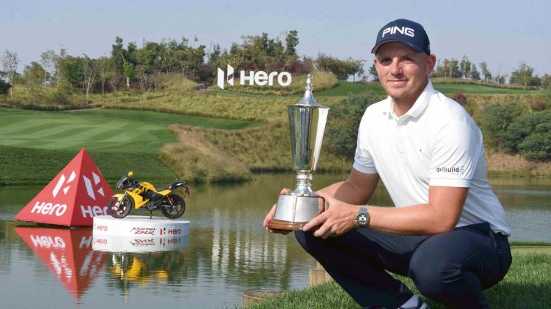 England’s Matt Wallace poses with the Indian Open winner’s trophy in Gurgaon on Sunday. England’s Matt Wallace poses with the Indian Open winner’s trophy in Gurgaon on Sunday.