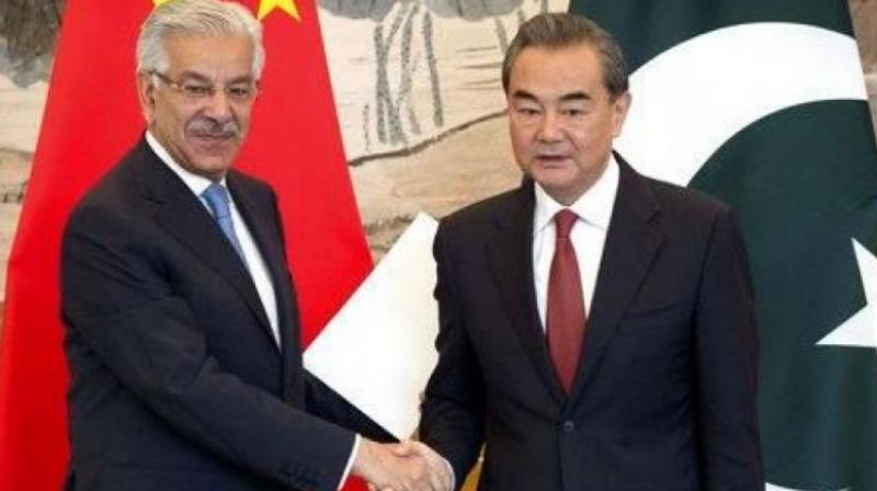 Pakistan's Foreign Minister Khawaja Muhammad Asif (left) and Chinese Foreign Minister Wang Yi. (Photo: AP/File) Pakistan's Foreign Minister Khawaja Muhammad Asif (left) and Chinese Foreign Minister Wang Yi. (Photo: AP/File)