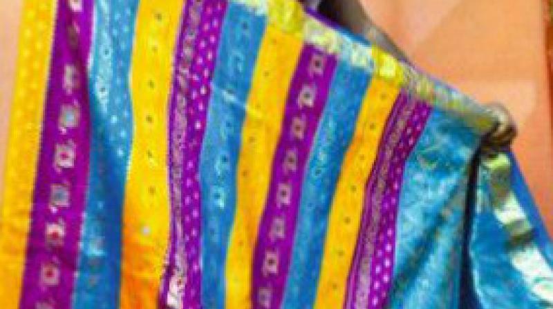 All the pressure cookers and saree packets had the image of RR Nagar Congress MLA Munirathna. According to a complaint by the sector magistrate, the goodies were meant to be distributed to woo voters of RR Nagar constituency. All the pressure cookers and saree packets had the image of RR Nagar Congress MLA Munirathna. According to a complaint by the sector magistrate, the goodies were meant to be distributed to woo voters of RR Nagar constituency.