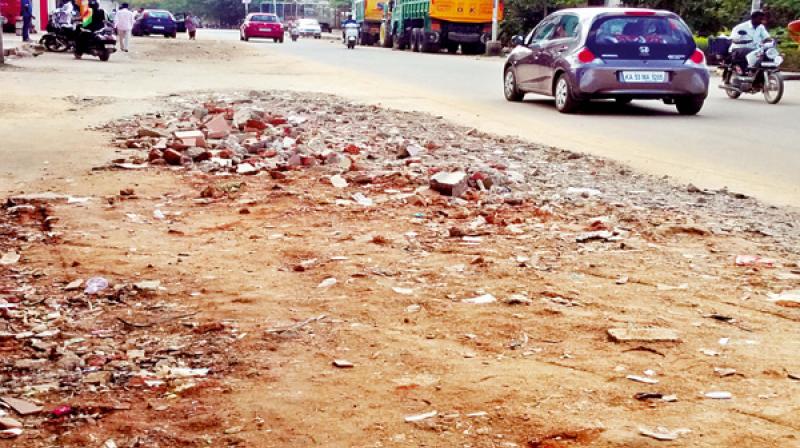The uneven road is offering a backbreaking bumpy ride to motorists. The uneven road is offering a backbreaking bumpy ride to motorists.
