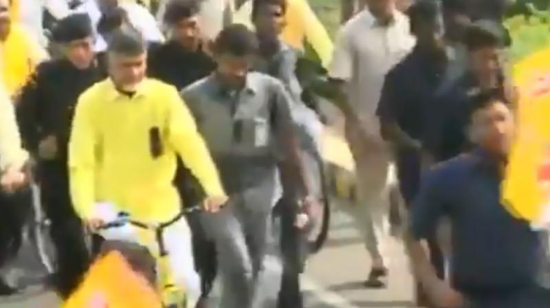 Andhra Pradesh Chief Minister N Chandrababu Naidu led the rally from Venkatapalem village to the State Secretariat in Amaravati. (Photo: ANI screengrab) Andhra Pradesh Chief Minister N Chandrababu Naidu led the rally from Venkatapalem village to the State Secretariat in Amaravati. (Photo: ANI screengrab)