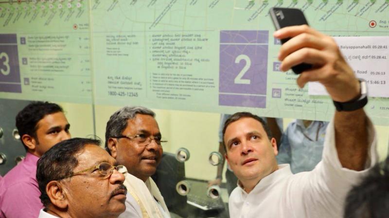 Congress president Rahul Gandhi bought the ticket at the station and took a selfie with the chief minister before boarding the jam-packed train. (Photo: Twitter/@INCIndia) Congress president Rahul Gandhi bought the ticket at the station and took a selfie with the chief minister before boarding the jam-packed train. (Photo: Twitter/@INCIndia)