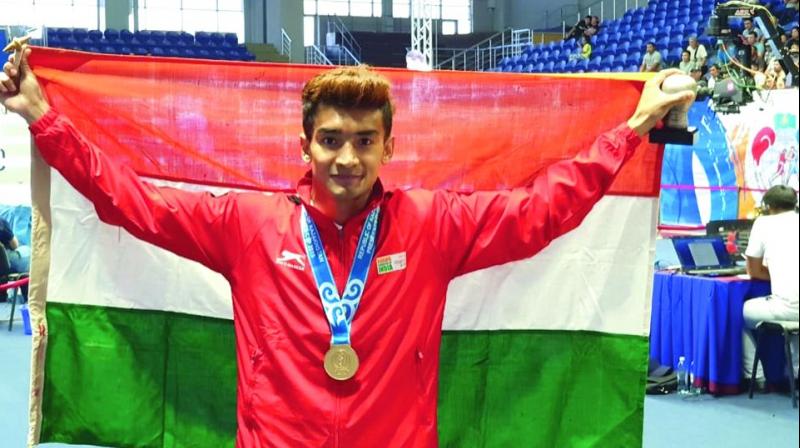 Shiva Thapa celebrates his gold medal. Shiva Thapa celebrates his gold medal.