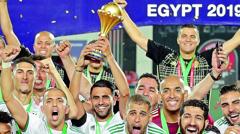 Algeria’s captain Riyad Mahrez (center) holds the trophy at the end of the final against Senegal. (Photo: AP) Algeria’s captain Riyad Mahrez (center) holds the trophy at the end of the final against Senegal. (Photo: AP)