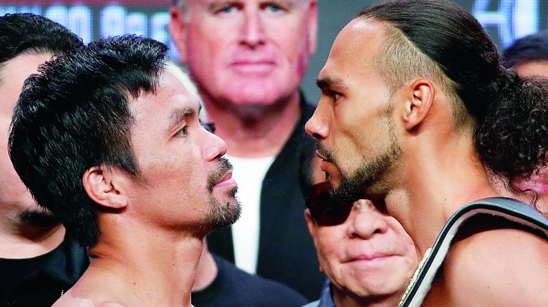 Manny Pacquiao (left) and Keith Thurman pose during a weigh-in on Friday in Las Vegas. (Photo: AP) Manny Pacquiao (left) and Keith Thurman pose during a weigh-in on Friday in Las Vegas. (Photo: AP)