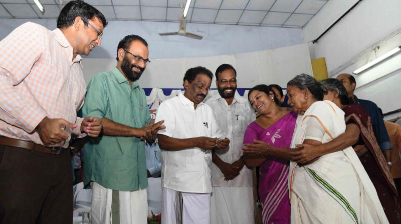 SC/ST Welfare Minister A.K. Balan hands over the keys of houses built for flood affected families in Thiruvananthapuram on Saturday. Financial assistance for the affected families was also distributed on the occasion. SC/ST Welfare Minister A.K. Balan hands over the keys of houses built for flood affected families in Thiruvananthapuram on Saturday. Financial assistance for the affected families was also distributed on the occasion.
