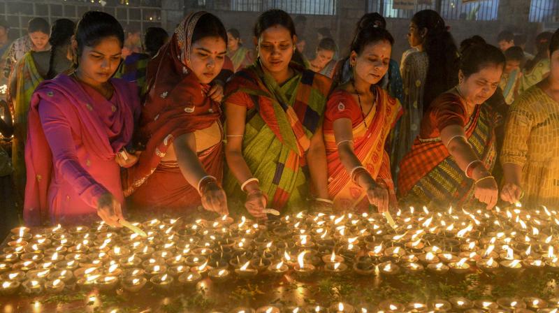 An avalanche of mixed reactions followed the prime ministers message to light a lamp on Sunday. (AFP)