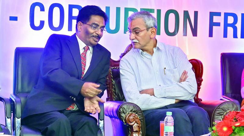 Chief Vigilance Commissioner K.V. Chowdary (right) interacts with Principal Chief Commissioner of Income Tax department S.P. Choudhury while addressing Vision — Corruption Free India as a part of Vigilance Awareness Week at the Amaravathi Aditorium, Income Tax Guest House, Banjara Hills on Friday. (Photo: DC) Chief Vigilance Commissioner K.V. Chowdary (right) interacts with Principal Chief Commissioner of Income Tax department S.P. Choudhury while addressing Vision — Corruption Free India as a part of Vigilance Awareness Week at the Amaravathi Aditorium, Income Tax Guest House, Banjara Hills on Friday. (Photo: DC)