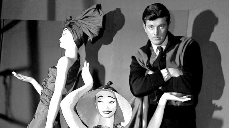 In this Feb.1 1952 file photo, French fashion designer Hubert de Givenchy poses with mannequins in his shop in Paris. French couturier Hubert de Givenchy, a pioneer of ready-to-wear who designed Audrey Hepburn's little black dress in In this Feb.1 1952 file photo, French fashion designer Hubert de Givenchy poses with mannequins in his shop in Paris. French couturier Hubert de Givenchy, a pioneer of ready-to-wear who designed Audrey Hepburn's little black dress in