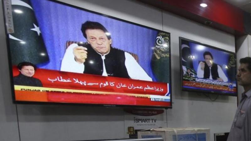 People watch a televised address of Pakistan’s newly elected Prime Minister Imran Khan at an electronic shop in Karachi, Pakistan, Sunday, August 19, 2018. (Photo: AP) People watch a televised address of Pakistan’s newly elected Prime Minister Imran Khan at an electronic shop in Karachi, Pakistan, Sunday, August 19, 2018. (Photo: AP)