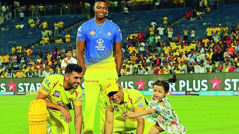 M.S. Dhoni plays with his daughter Ziva as CSK teammates Deepak Chahar (left) and Lungi Ngidi look on. (Photo: BCCI) M.S. Dhoni plays with his daughter Ziva as CSK teammates Deepak Chahar (left) and Lungi Ngidi look on. (Photo: BCCI)