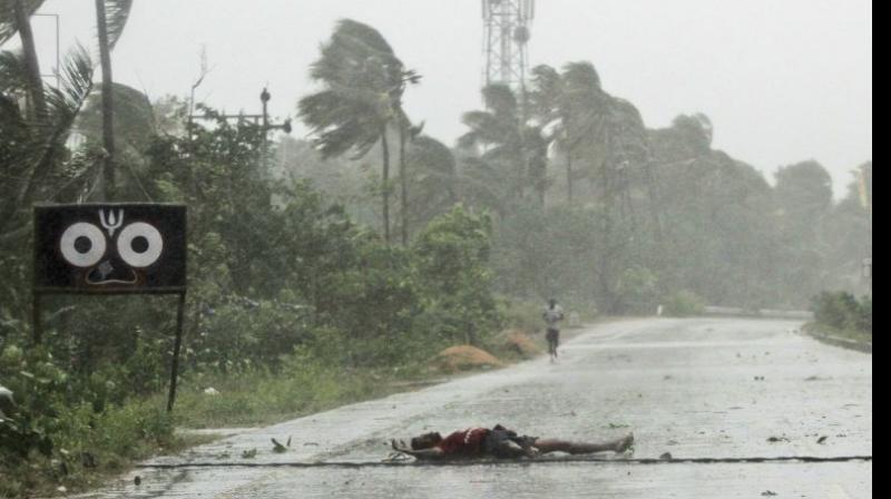 The eye of cyclonic storm 'Fani' has 'completely moved into land' by 10 am Friday weakening its fury, but heavy rainfall is still predicted in Odisha, Andhra Pradesh, West Bengal and parts of the northeastern states, the Home Ministry said on Friday. (Photo: AP) The eye of cyclonic storm 'Fani' has 'completely moved into land' by 10 am Friday weakening its fury, but heavy rainfall is still predicted in Odisha, Andhra Pradesh, West Bengal and parts of the northeastern states, the Home Ministry said on Friday. (Photo: AP)