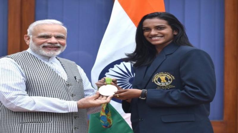 Sindhu became the first Indian to win a World Championships gold medal by defeating Japan's Nozomi Okuhara 21-7, 21-7 in the finals of the tournament on Sunday. (Photo: Twitter) Sindhu became the first Indian to win a World Championships gold medal by defeating Japan's Nozomi Okuhara 21-7, 21-7 in the finals of the tournament on Sunday. (Photo: Twitter)