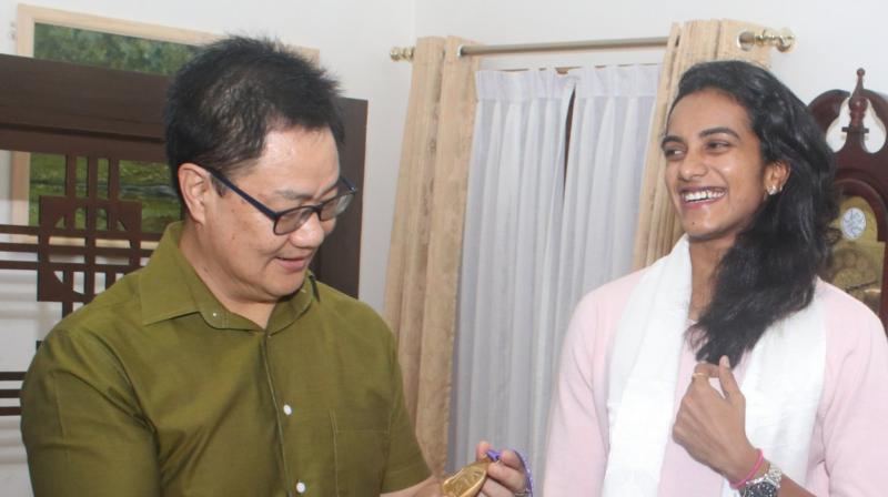 Sindhu became the first Indian to win a World Championships gold medal by defeating Japan's Nozomi Okuhara 21-7, 21-7 in the finals of the tournament on Sunday. (Photo: Kiren Rijiju/Twitter) Sindhu became the first Indian to win a World Championships gold medal by defeating Japan's Nozomi Okuhara 21-7, 21-7 in the finals of the tournament on Sunday. (Photo: Kiren Rijiju/Twitter)