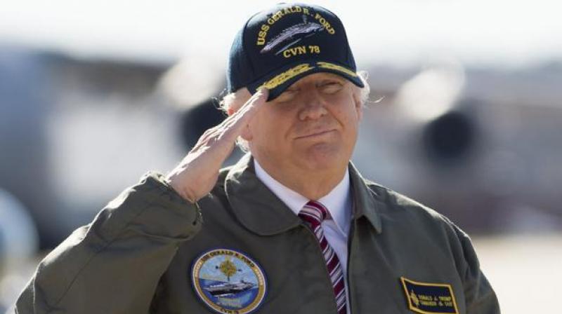 US President Donald Trump salutes as he travelled to Newport News, Virginia, to visit the pre-commissioned USS Gerald R. Ford aircraft carrier. (Photo: AFP) US President Donald Trump salutes as he travelled to Newport News, Virginia, to visit the pre-commissioned USS Gerald R. Ford aircraft carrier. (Photo: AFP)