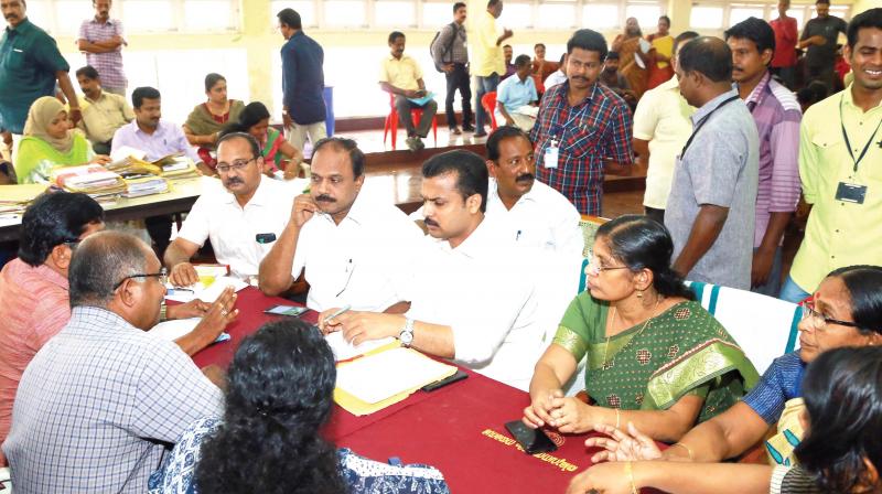 Mayor V.K. Prasanth listens to complaints as the building adalat is in progress on Monday. Corporation Secretary Deepa L.S, standing committee chairpersons Shafeera Beegum and Satheesh Kumar R, as well as Nanthancode councillor Palayam Rajan can be seen. (Photo: DC) Mayor V.K. Prasanth listens to complaints as the building adalat is in progress on Monday. Corporation Secretary Deepa L.S, standing committee chairpersons Shafeera Beegum and Satheesh Kumar R, as well as Nanthancode councillor Palayam Rajan can be seen. (Photo: DC)
