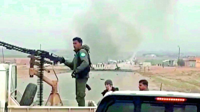 An image grab taken from a video on Monday shows the scene of a suicide car bomb attack on a military convoy on a road in Syria’s Hasakeh province. (Photo: AFP/HO/ANHA) An image grab taken from a video on Monday shows the scene of a suicide car bomb attack on a military convoy on a road in Syria’s Hasakeh province. (Photo: AFP/HO/ANHA)