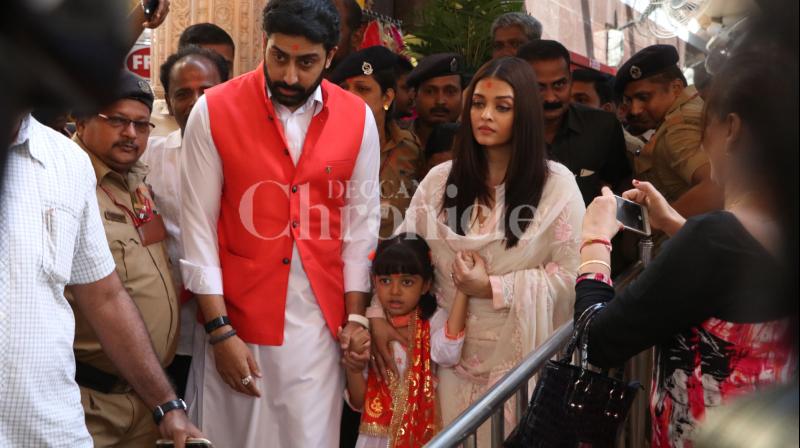 Abhishek and Aishwarya with daughter Aaradhya at Siddhivinayak temple to seek blessings on their 10th wedding anniversary. Abhishek and Aishwarya with daughter Aaradhya at Siddhivinayak temple to seek blessings on their 10th wedding anniversary.