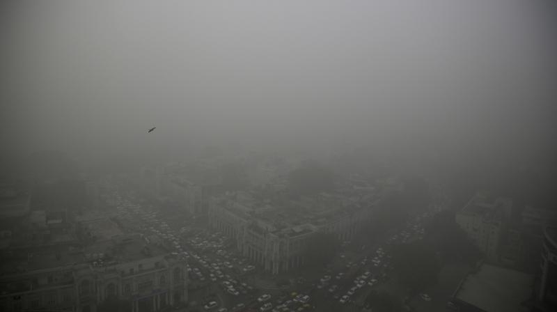 A thick layer of smog covers Connaught Place, New Delhi. (Photo: AP) A thick layer of smog covers Connaught Place, New Delhi. (Photo: AP)