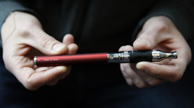 E-cigarettes are hand-held devices that vaporize liquid nicotine. (Photo: AP) E-cigarettes are hand-held devices that vaporize liquid nicotine. (Photo: AP)
