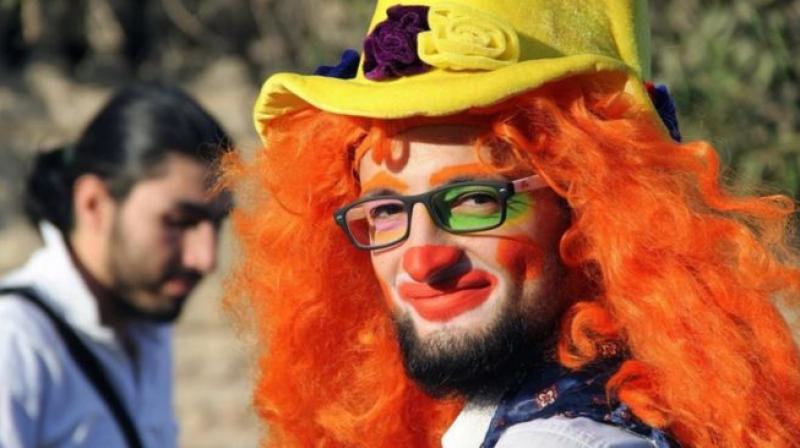 This undated photo courtesy of Ahmad al-Khatib, a media activist in Aleppo, shows Syrian social worker Anas al-Basha, 24, dressed as a clown, while posing for a photograph in Aleppo, Syria. (Photo: AP) This undated photo courtesy of Ahmad al-Khatib, a media activist in Aleppo, shows Syrian social worker Anas al-Basha, 24, dressed as a clown, while posing for a photograph in Aleppo, Syria. (Photo: AP)