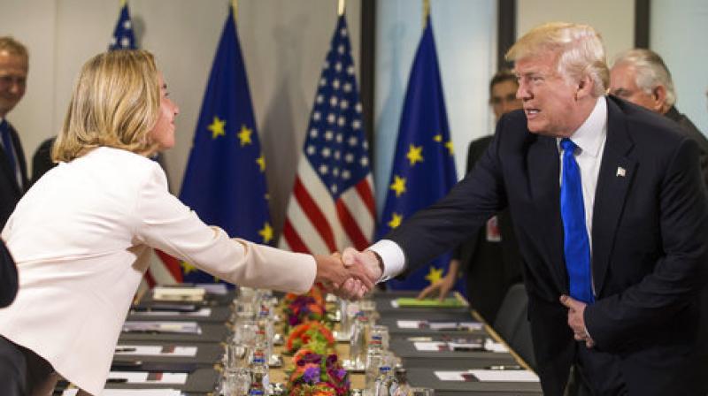 US President Donald Trump is welcomed by Federica Mogherini, the EU High representative for foreign policy, as they attend a meeting with US and EU leaders at the European Council in Brussels. (Photo:AP) US President Donald Trump is welcomed by Federica Mogherini, the EU High representative for foreign policy, as they attend a meeting with US and EU leaders at the European Council in Brussels. (Photo:AP)