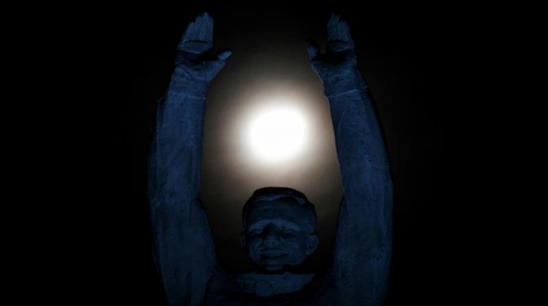 A statue of the first man in space, Russia's Yuri Gagarin, reaching for the moon (Image: AFP) A statue of the first man in space, Russia's Yuri Gagarin, reaching for the moon (Image: AFP)