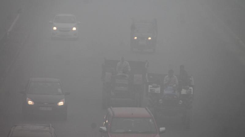 Vehicles move through dense fog at Delhi- Agra Highway in Faridabad on Thursday. (Photo: PTI) Vehicles move through dense fog at Delhi- Agra Highway in Faridabad on Thursday. (Photo: PTI)