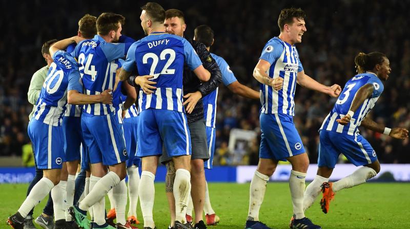 Chants of "we are staying up" rang around a packed house at the Amex Stadium at full-time as victory moved Brighton up to 11th and more importantly eight points clear of the bottom three. (Photo: AFP) Chants of "we are staying up" rang around a packed house at the Amex Stadium at full-time as victory moved Brighton up to 11th and more importantly eight points clear of the bottom three. (Photo: AFP)